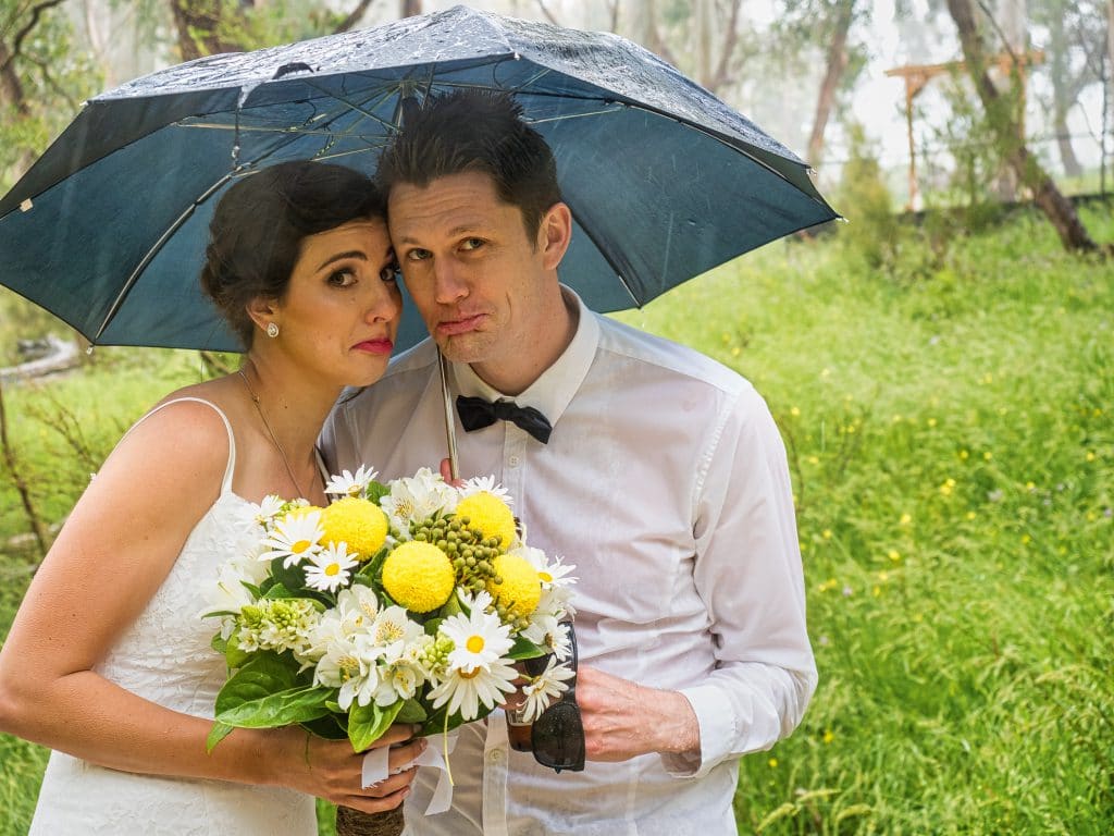 Couple with Umbrella in Rain