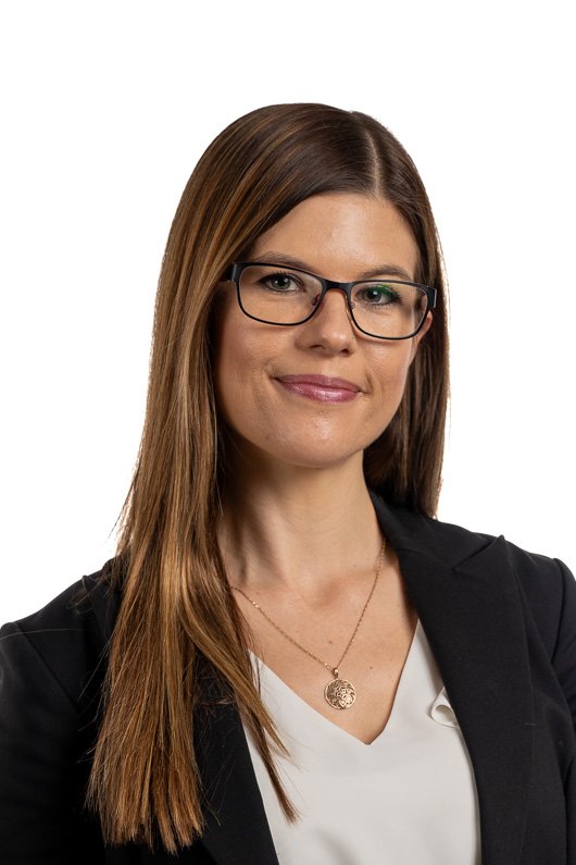 Young Woman with Glasses in Business Attire
